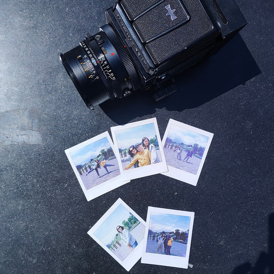 Jollylook Instant Back mounted on a Mamiya RB67 with Instax Square film loaded