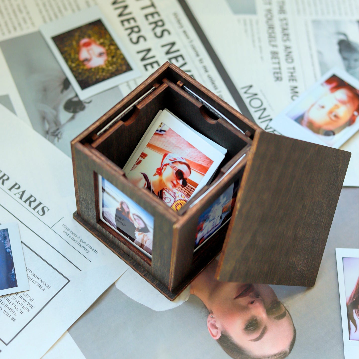 Jollylook Photo Box on a table with Instax Mini photos