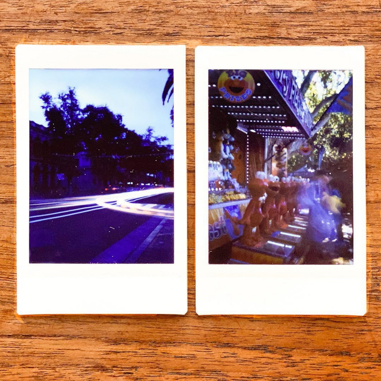 Two instant photos taken with a Jollylook Pinhole Mini camera, arranged on a table, capturing the excitement and variety of attractions at an amusement park