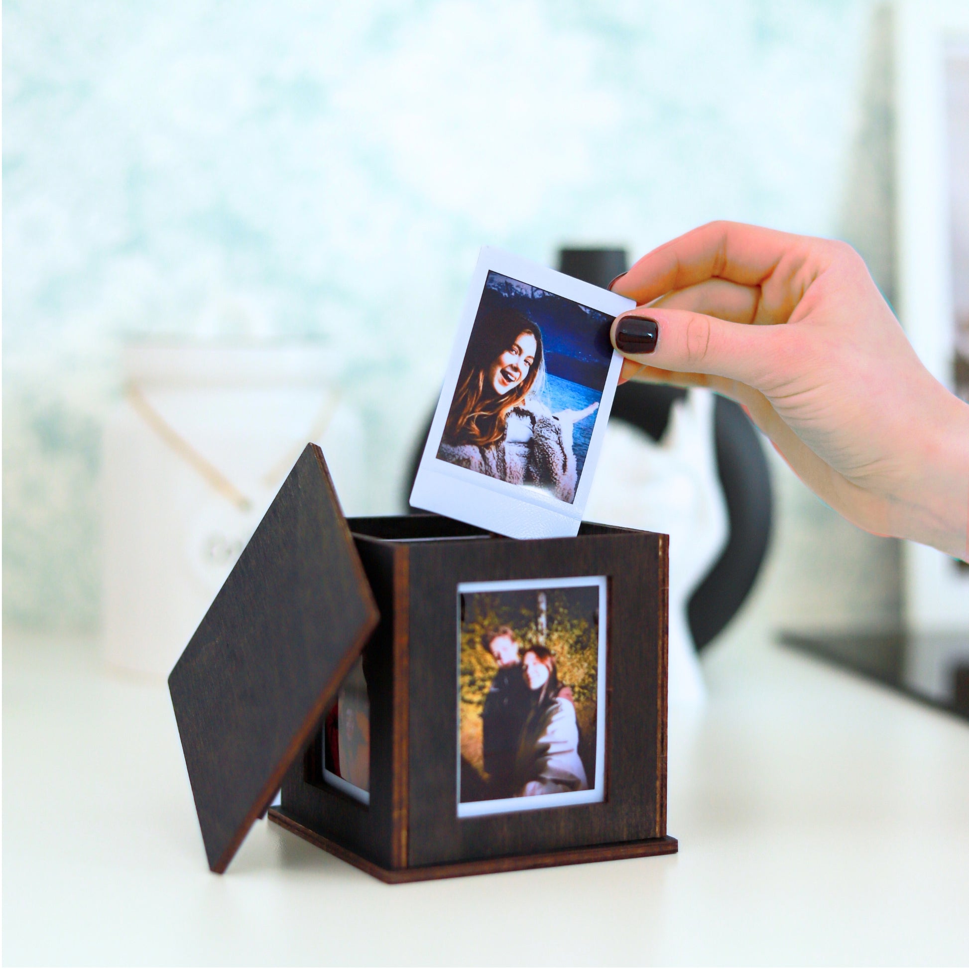 Jollylook Photo Box on a table with Instax Mini photos