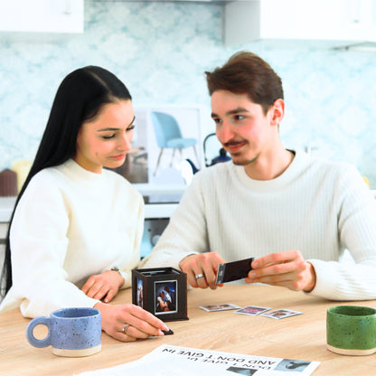 Jollylook Photo Box on a table with Instax Mini photos