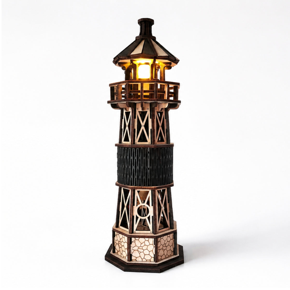 Jollylook Kinetic Lighthouse wooden mechanical model kit assembled and lit on a tabletop.
Hand-cranked rotating light mechanism inside The Kinetic Lighthouse.
Laser-cut beech plywood parts included in The Kinetic Lighthouse DIY kit