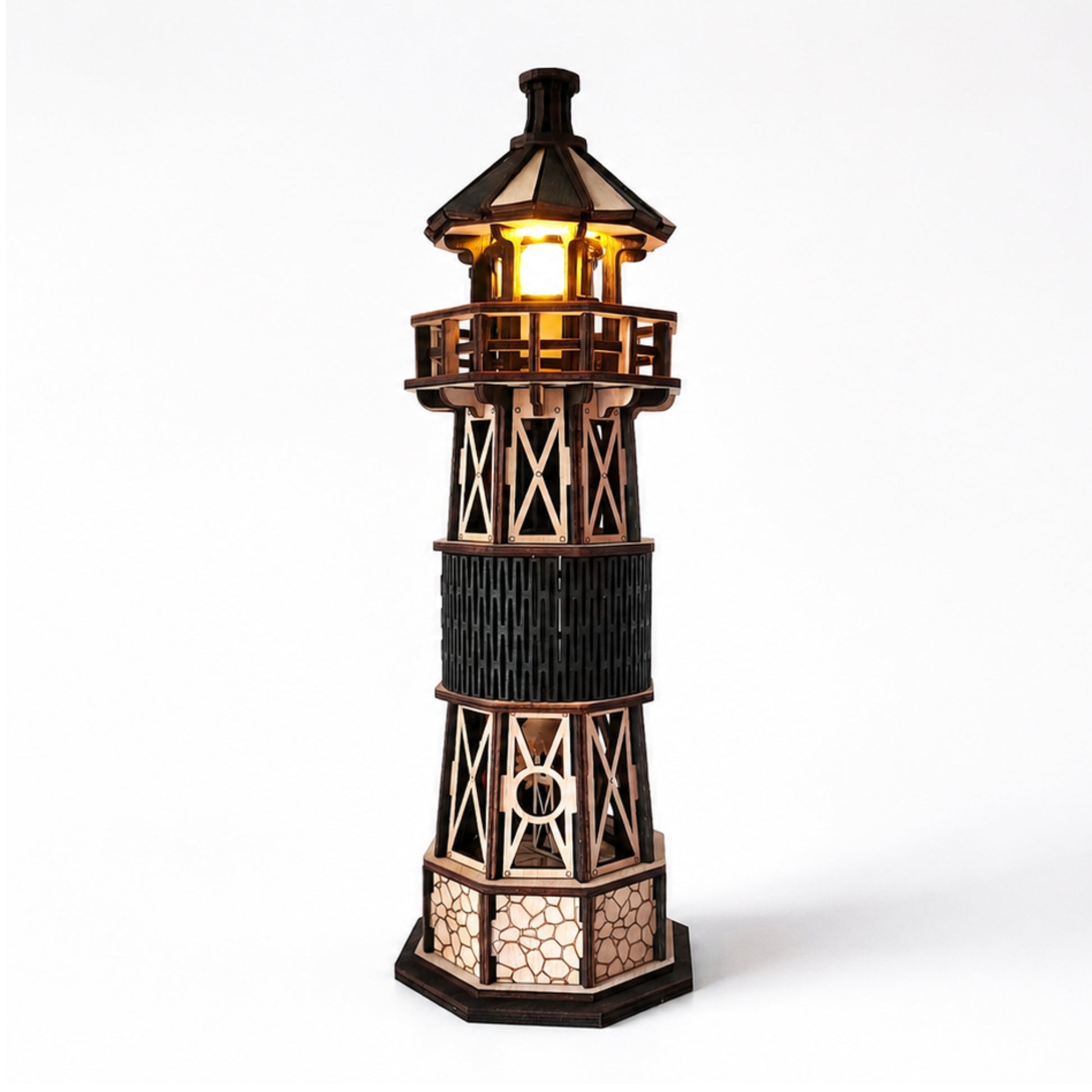 Jollylook Kinetic Lighthouse wooden mechanical model kit assembled and lit on a tabletop.
Hand-cranked rotating light mechanism inside The Kinetic Lighthouse.
Laser-cut beech plywood parts included in The Kinetic Lighthouse DIY kit